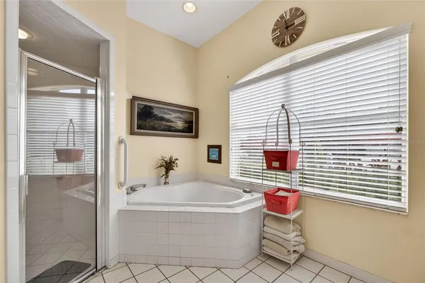 a bathroom with a tub and shower