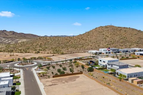 aerial view of residential houses with city view and mountain view