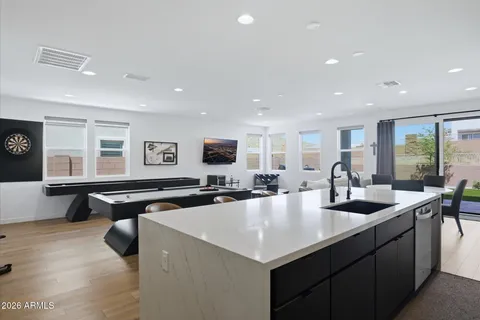 a kitchen with stainless steel appliances a refrigerator stove microwave and cabinets
