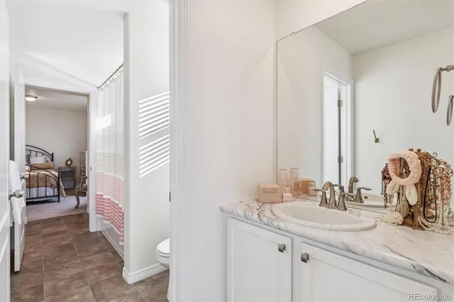 a en suite bathroom with a sink and a mirror