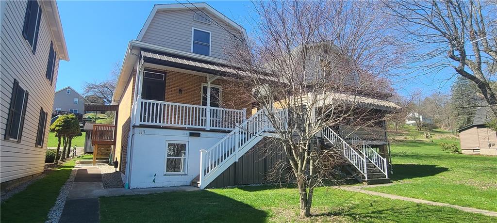 Front of with covered front porch.