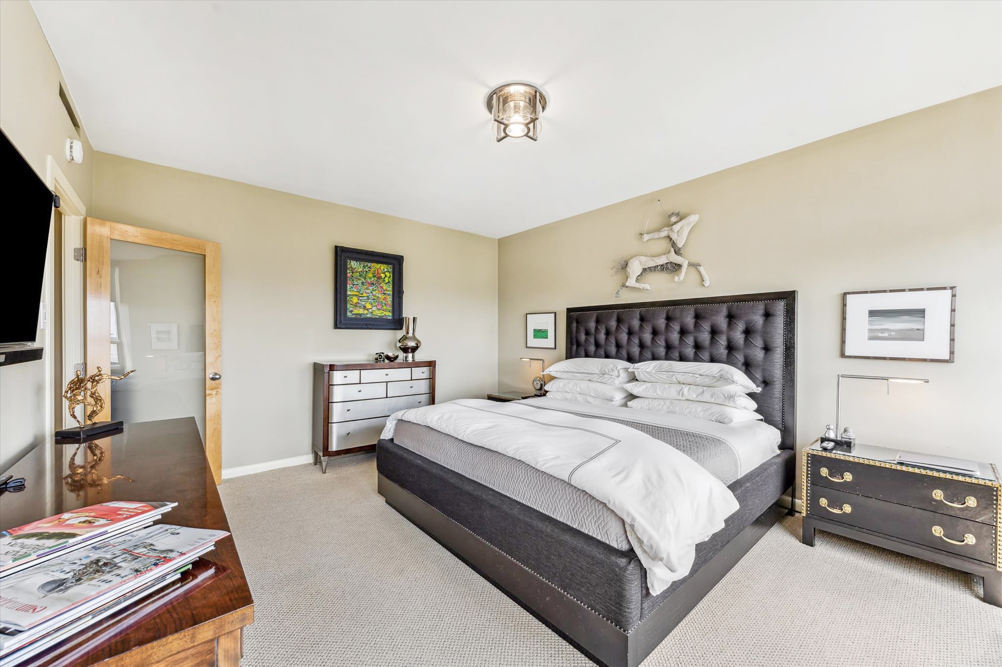 2701 Westheimer Road, Unit 9E Houston, TX 77098 - Photo 12 of 31 Another perspective of the primary bedroom, beautifully highlighting its inviting features and abundant wall space, perfect for showcasing your personal art collection or favorite décor and really allows you to personalize this wonderful space.