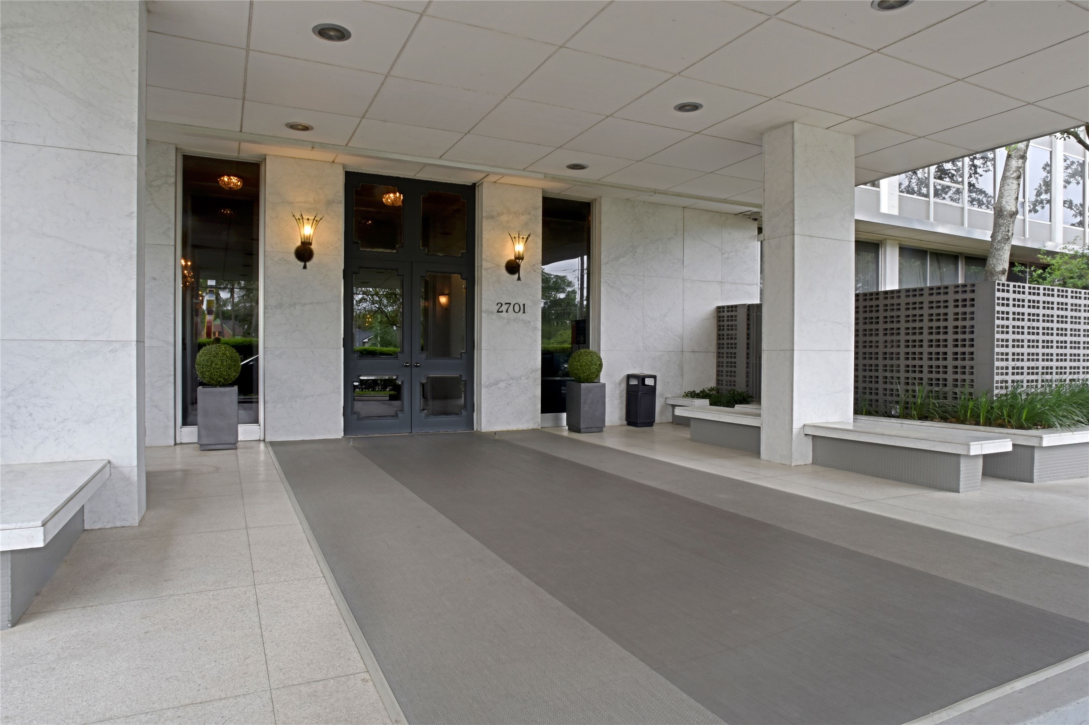 2701 Westheimer Road, Unit 9E Houston, TX 77098 - Photo 17 of 31 Welcome to the Regency House. 2701 Westheimer. This conveniently located property features a welcoming black door, offering a glimpse into the elegant interior awaiting.