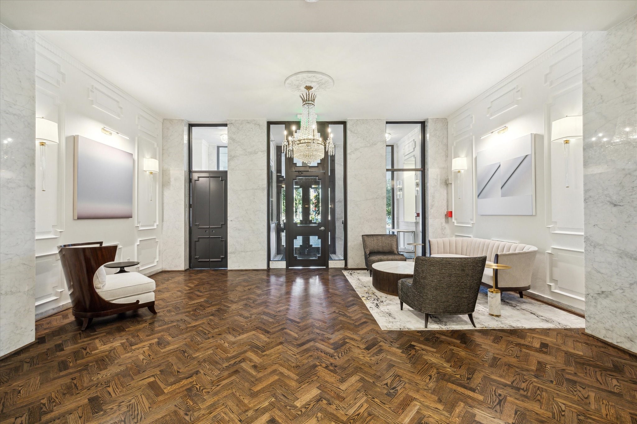 2701 Westheimer Road, Unit 9E Houston, TX 77098 - Photo 18 of 31 Lobby has been completely refreshed and re-decorated with Artwork by Kristen Cliburn. The new design features modern aesthetics and a welcoming atmosphere, enhancing the overall property appeal and resident experience.