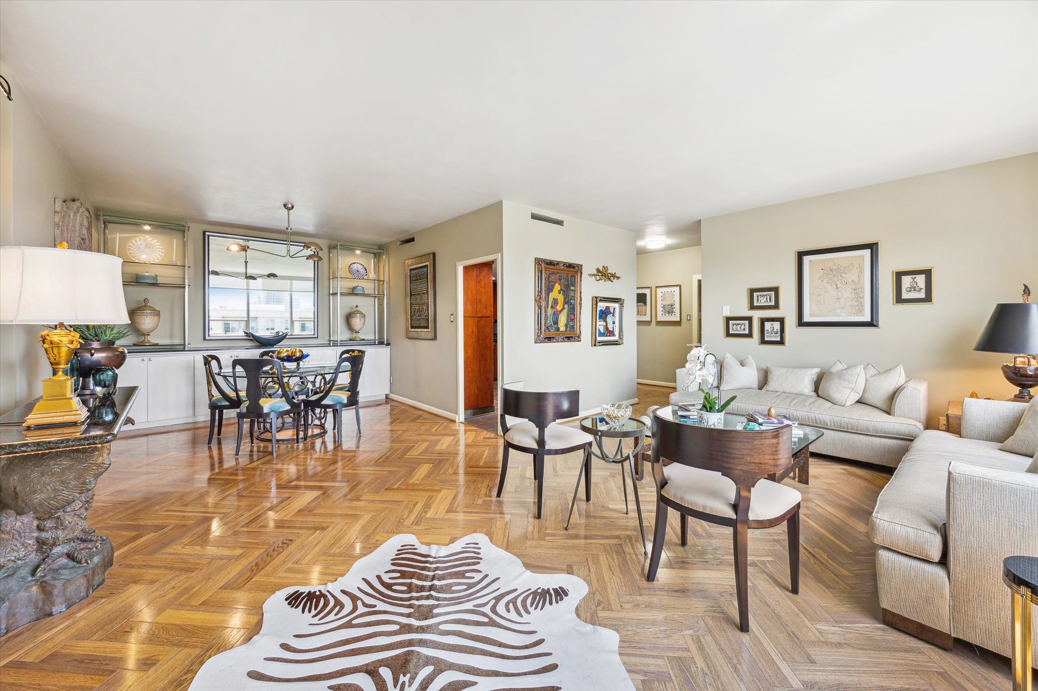 2701 Westheimer Road, Unit 9E Houston, TX 77098 - Photo 3 of 31 This image showcases a combined living and dining area, offering a comfortable and inviting space for both relaxation and meals.