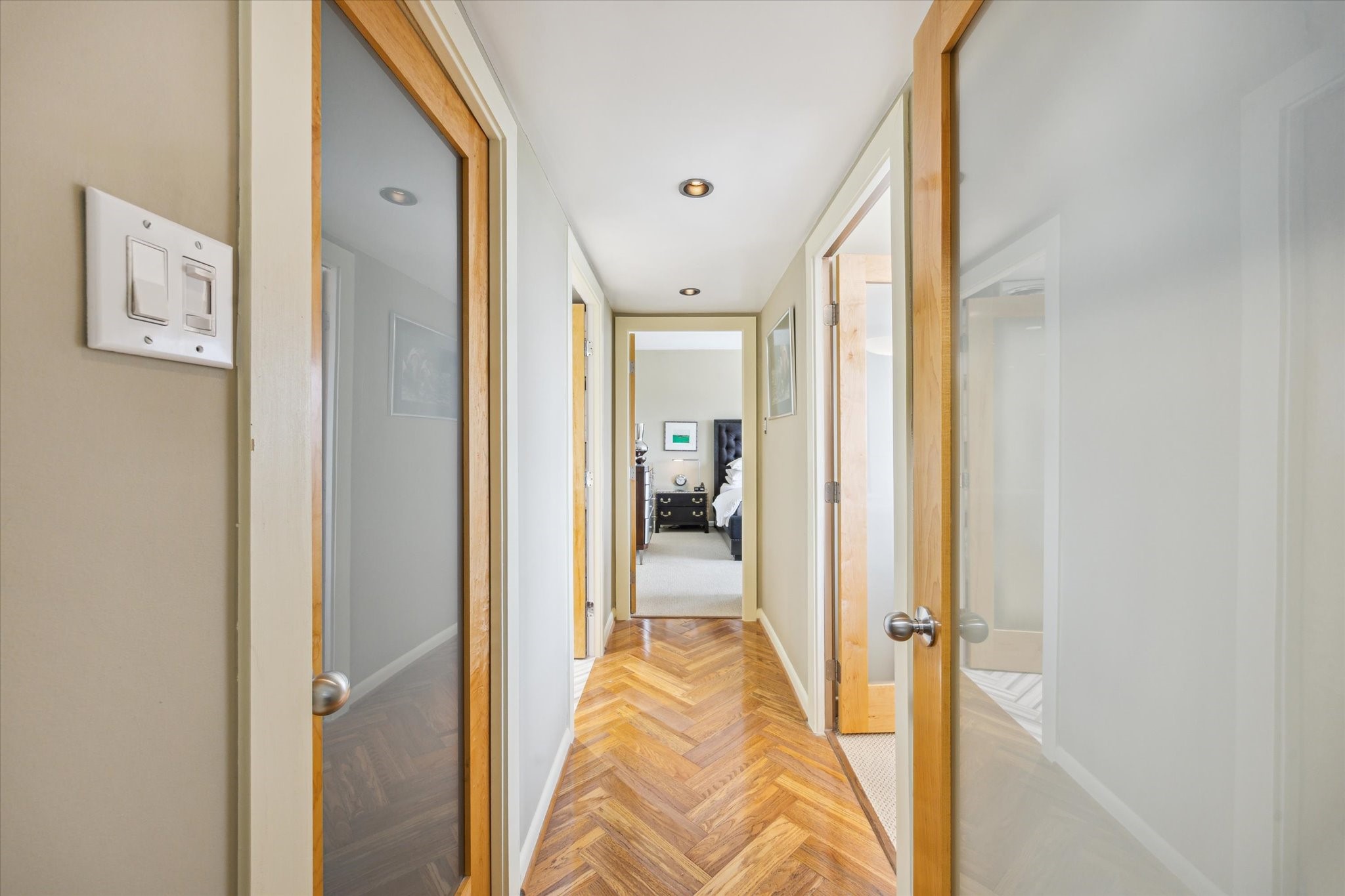 2701 Westheimer Road, Unit 9E Houston, TX 77098 - Photo 10 of 31 Hallway to bathroom, second bedroom, and primary bedroom. This description provides context about the location and rooms connected to the hallway.