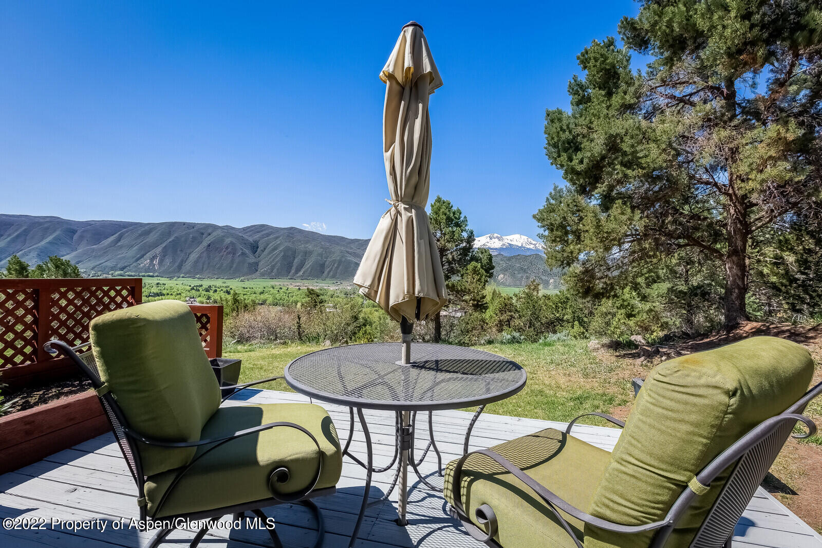805 Pinon Drive, Unit 1 Basalt, CO 81621 - Photo 14 of 19 a view of a chairs and table in backyard