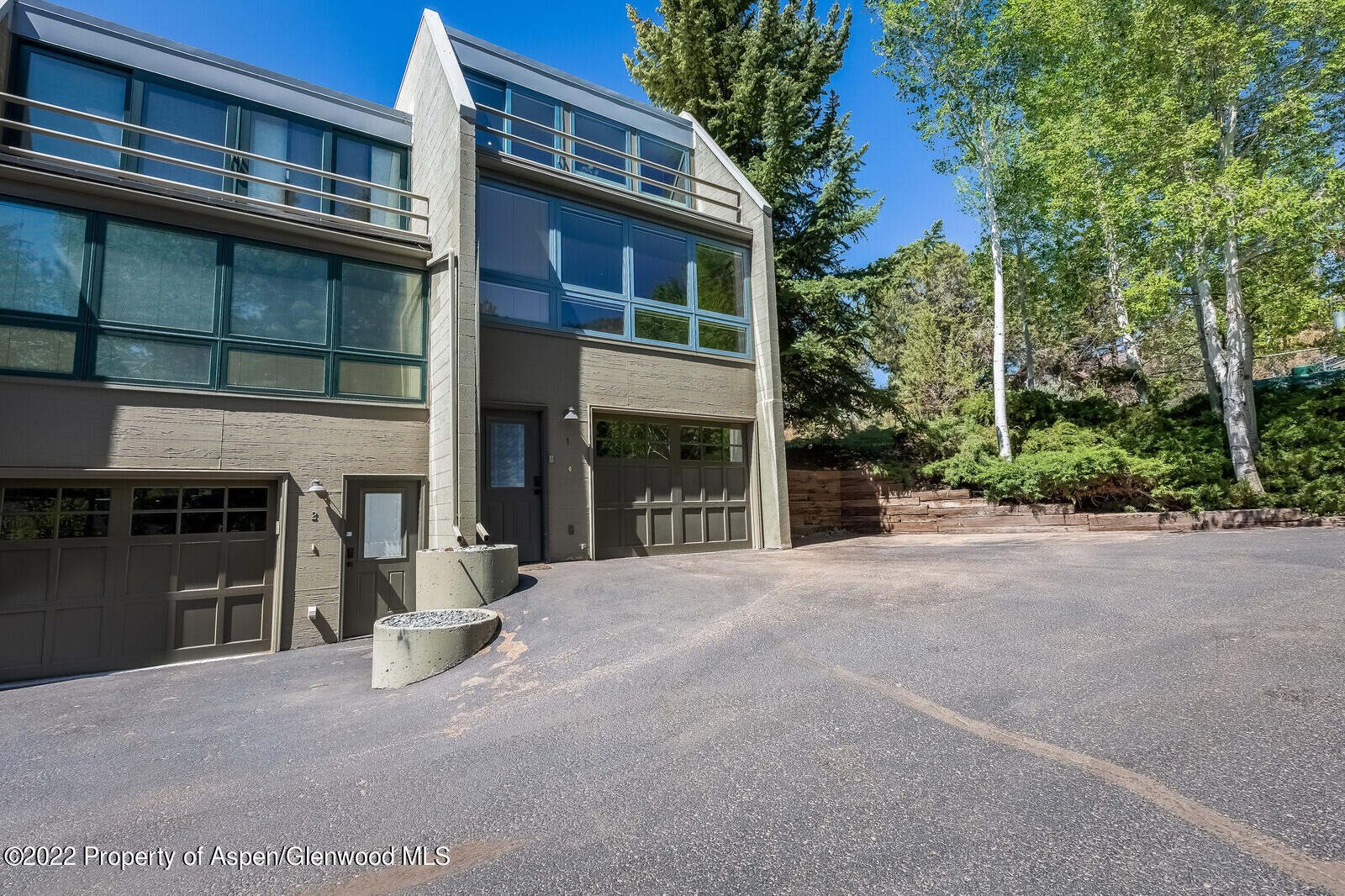 805 Pinon Drive, Unit 1 Basalt, CO 81621 - Photo 3 of 19 a view of a building with a garden