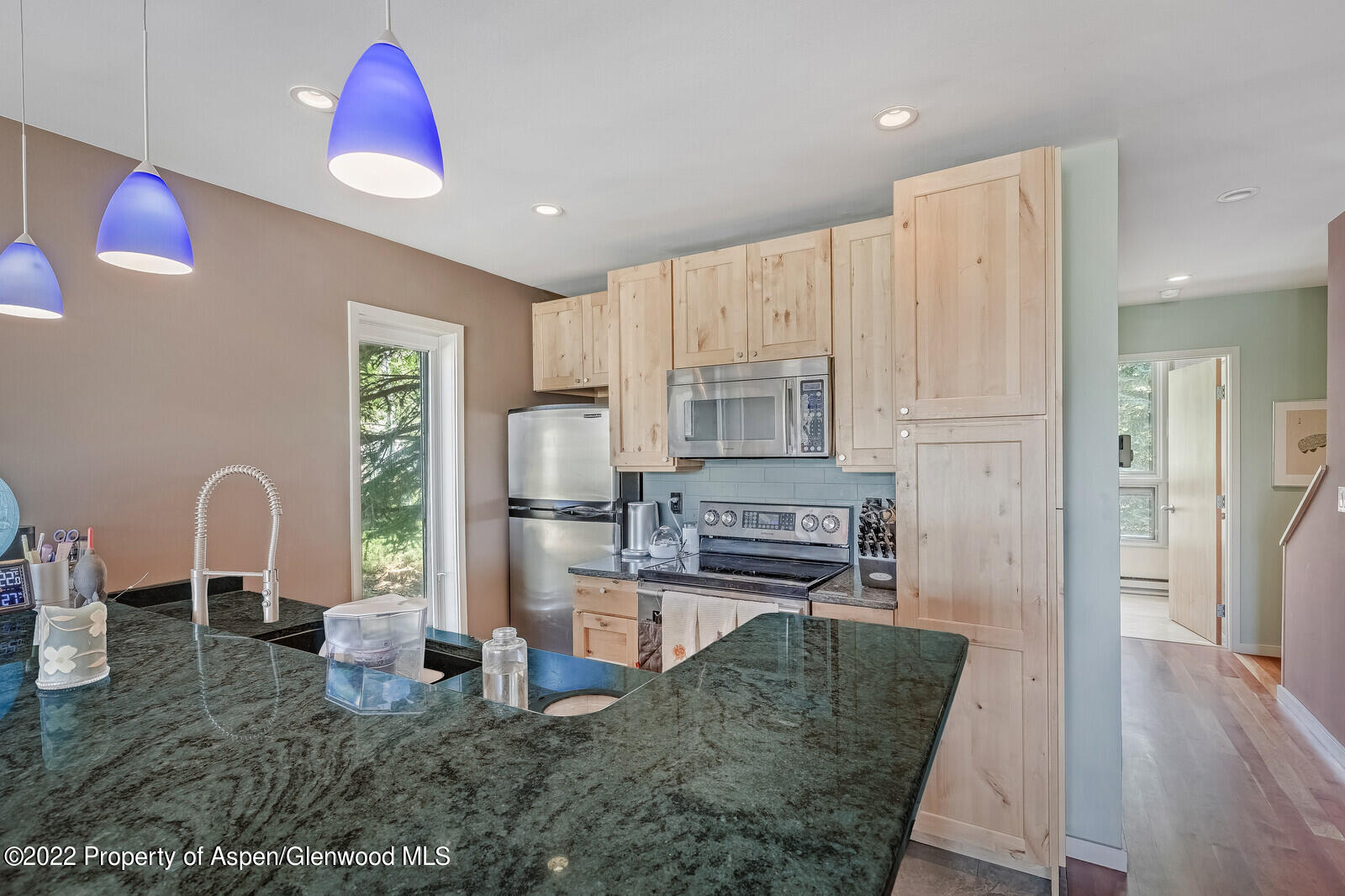 805 Pinon Drive, Unit 1 Basalt, CO 81621 - Photo 6 of 19 a kitchen with stainless steel appliances granite countertop a refrigerator sink and stove