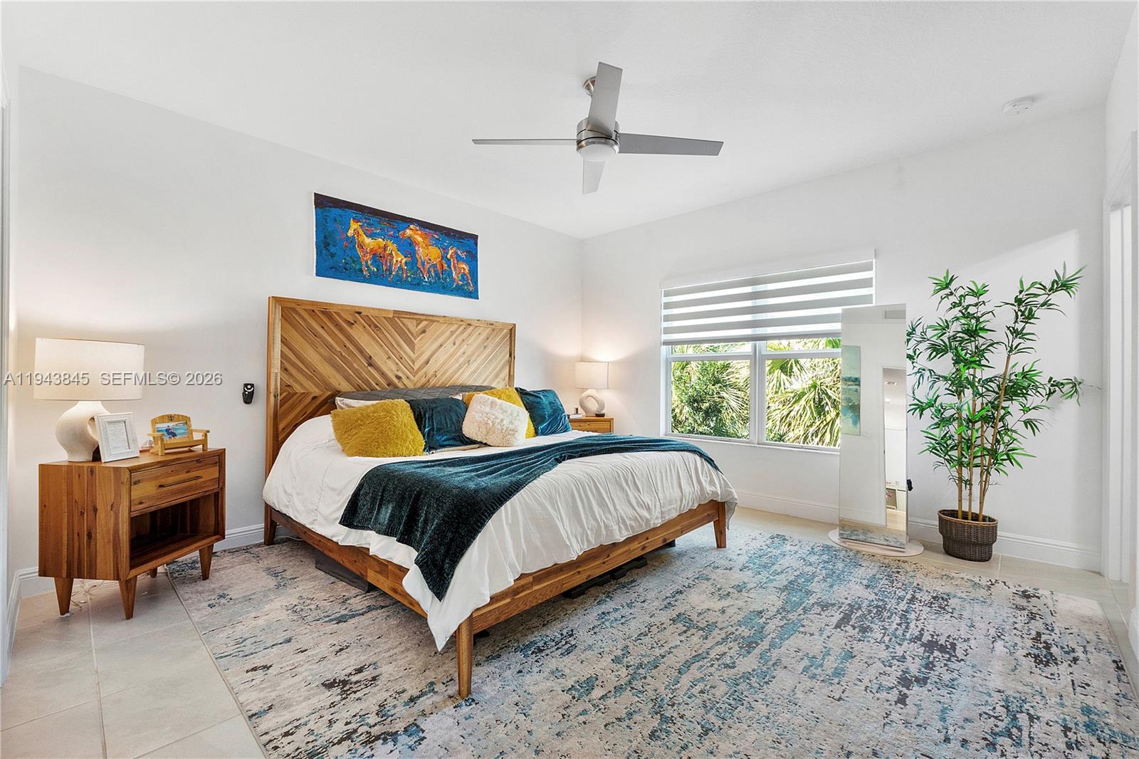 1827 Sandpiper Pointe Place Deerfield Beach, FL 33442 - Photo 24 of 48 a bedroom with a large bed and a potted plant