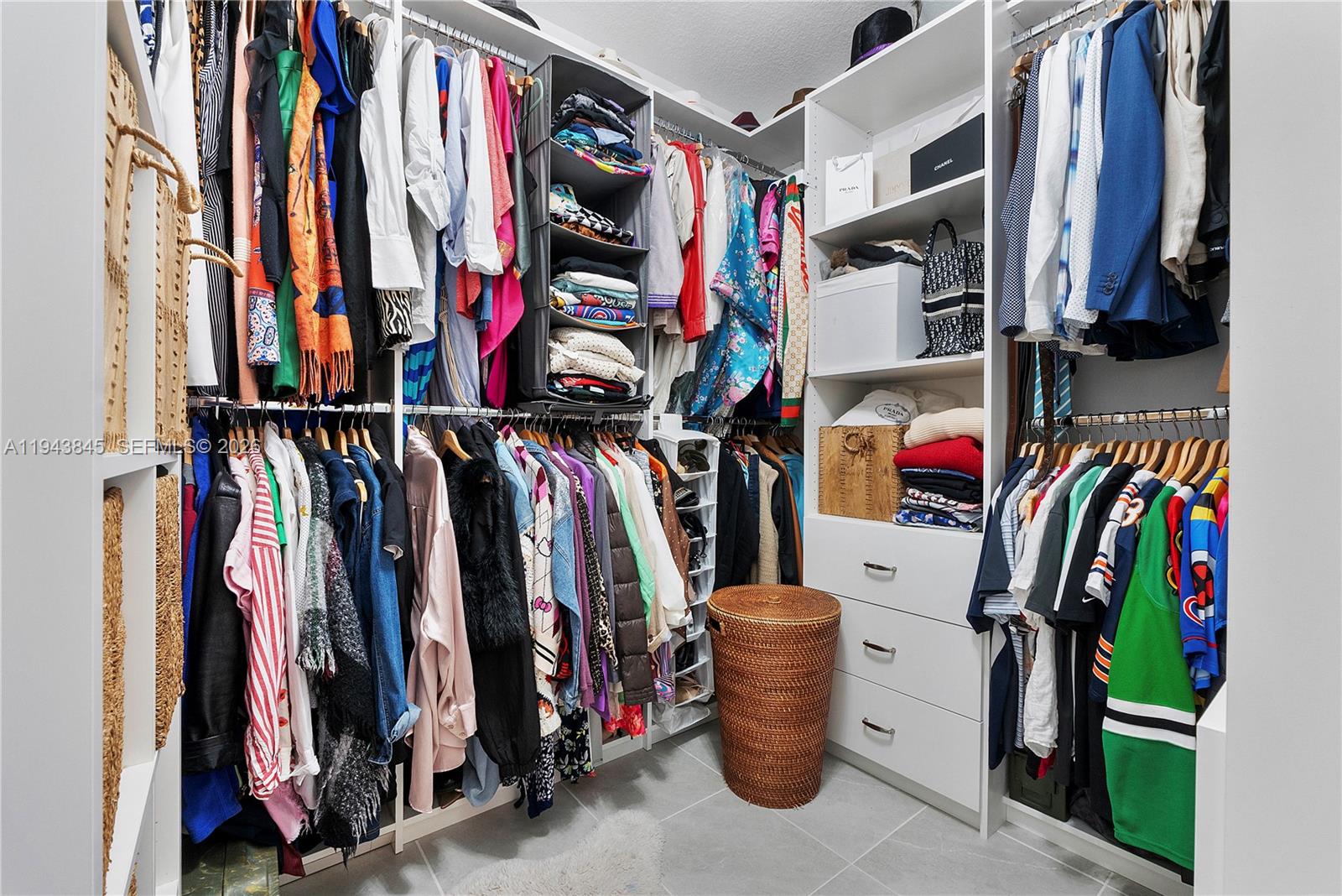 1827 Sandpiper Pointe Place Deerfield Beach, FL 33442 - Photo 26 of 48 a view of walk in closet with clothes