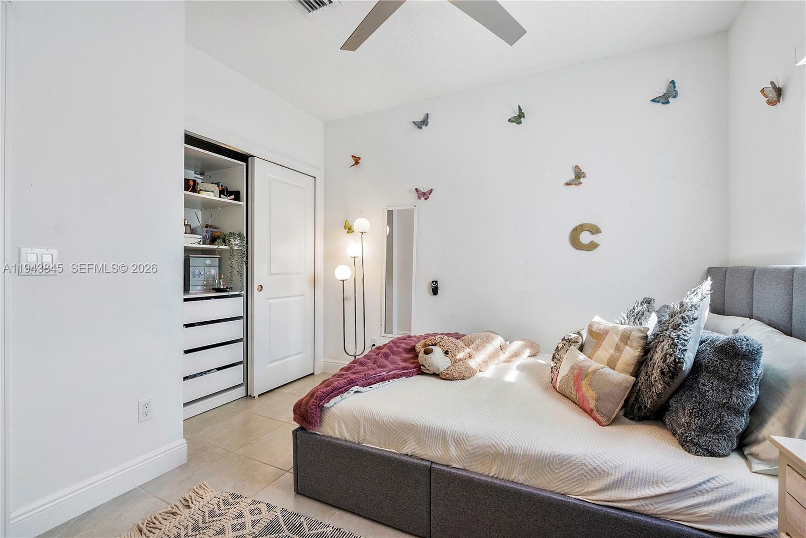 1827 Sandpiper Pointe Place Deerfield Beach, FL 33442 - Photo 29 of 48 a bedroom with a bed and a window