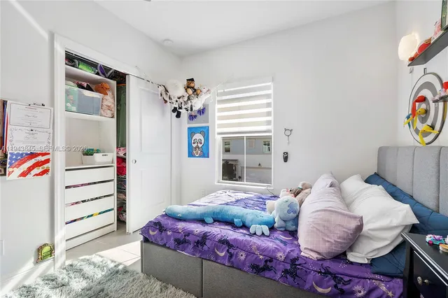 a bathroom with a sink vanity mirror and toilet