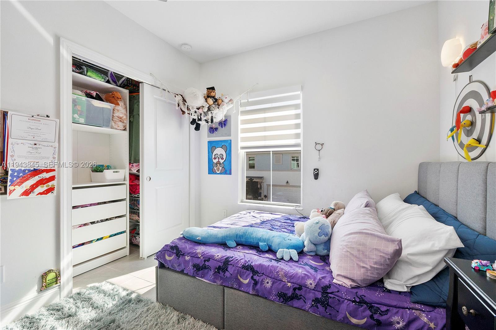 1827 Sandpiper Pointe Place Deerfield Beach, FL 33442 - Photo 31 of 48 a bedroom with a bed and a window