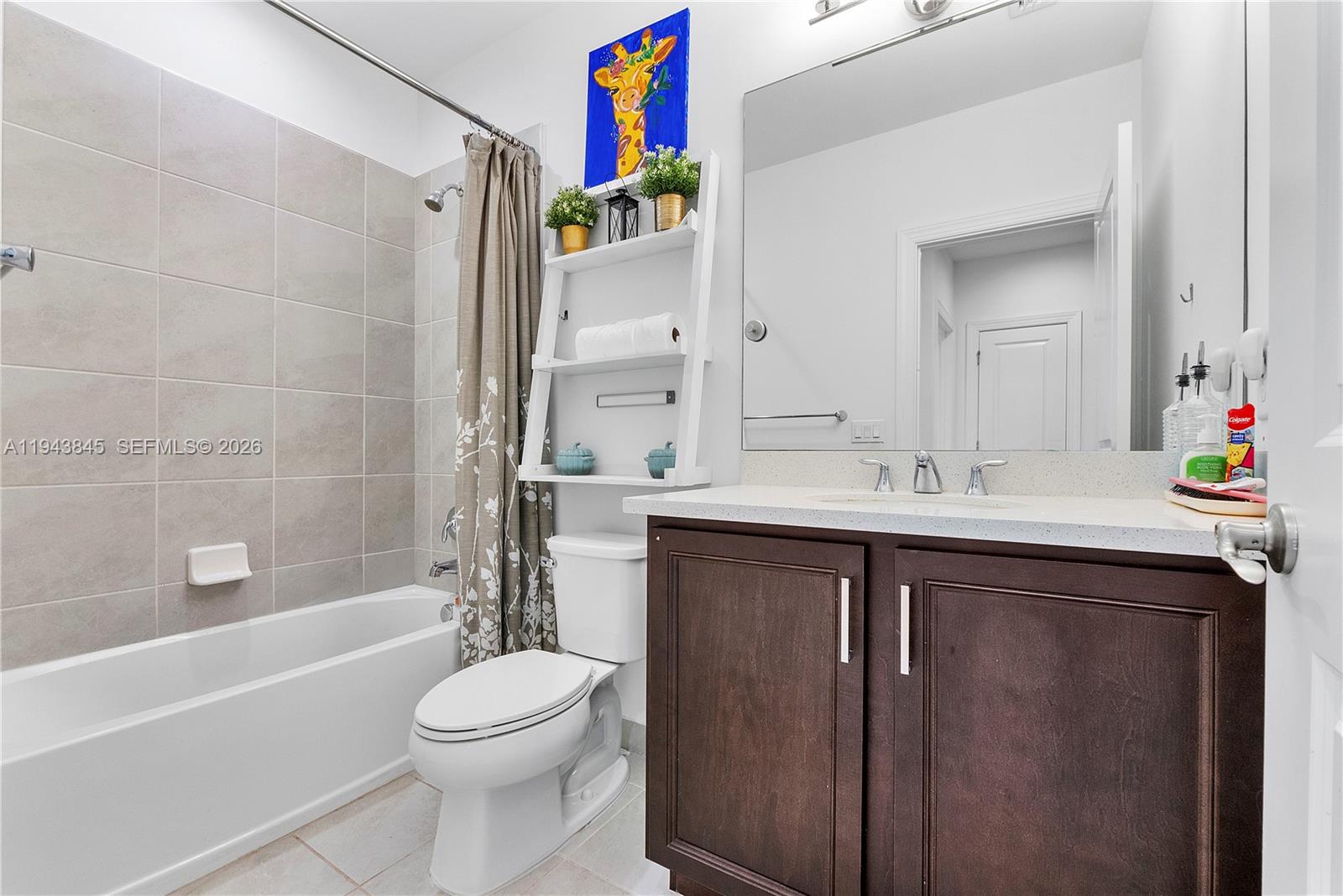 1827 Sandpiper Pointe Place Deerfield Beach, FL 33442 - Photo 34 of 48 a bathroom with a sink vanity mirror toilet and bathtub