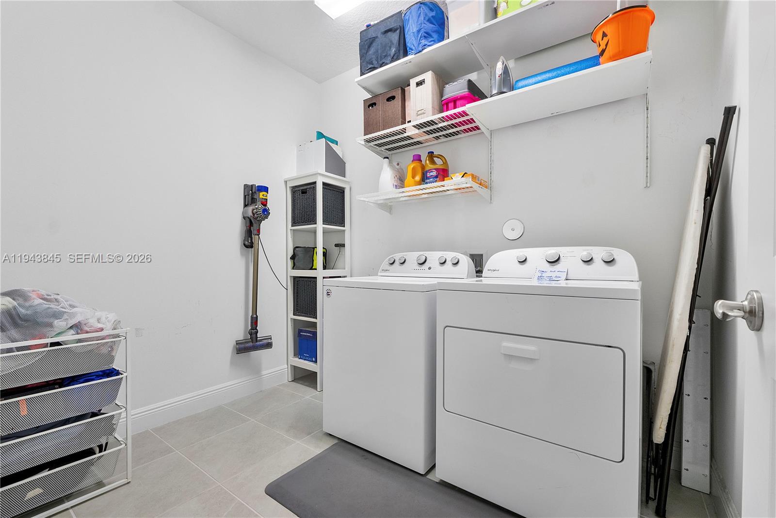 1827 Sandpiper Pointe Place Deerfield Beach, FL 33442 - Photo 35 of 48 a utility room with dryer and washer