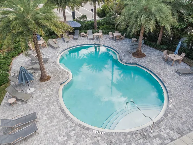 a view of a house with porch and garden