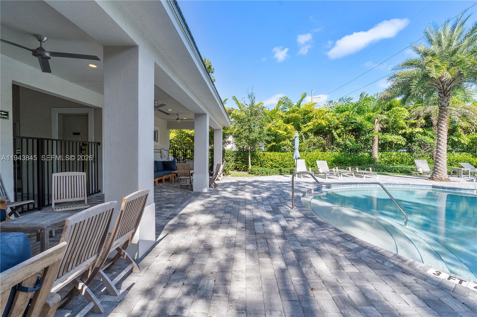 1827 Sandpiper Pointe Place Deerfield Beach, FL 33442 - Photo 46 of 48 a view of a house with porch and garden