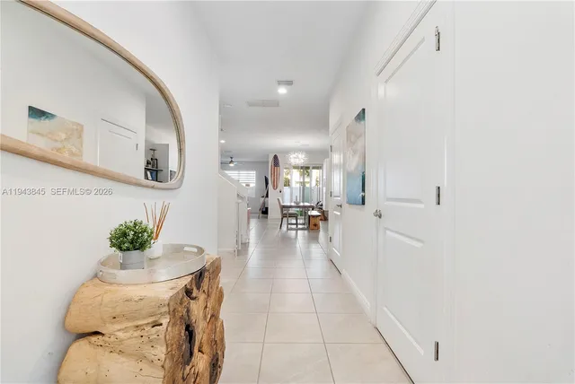 a lobby with furniture and a potted plant