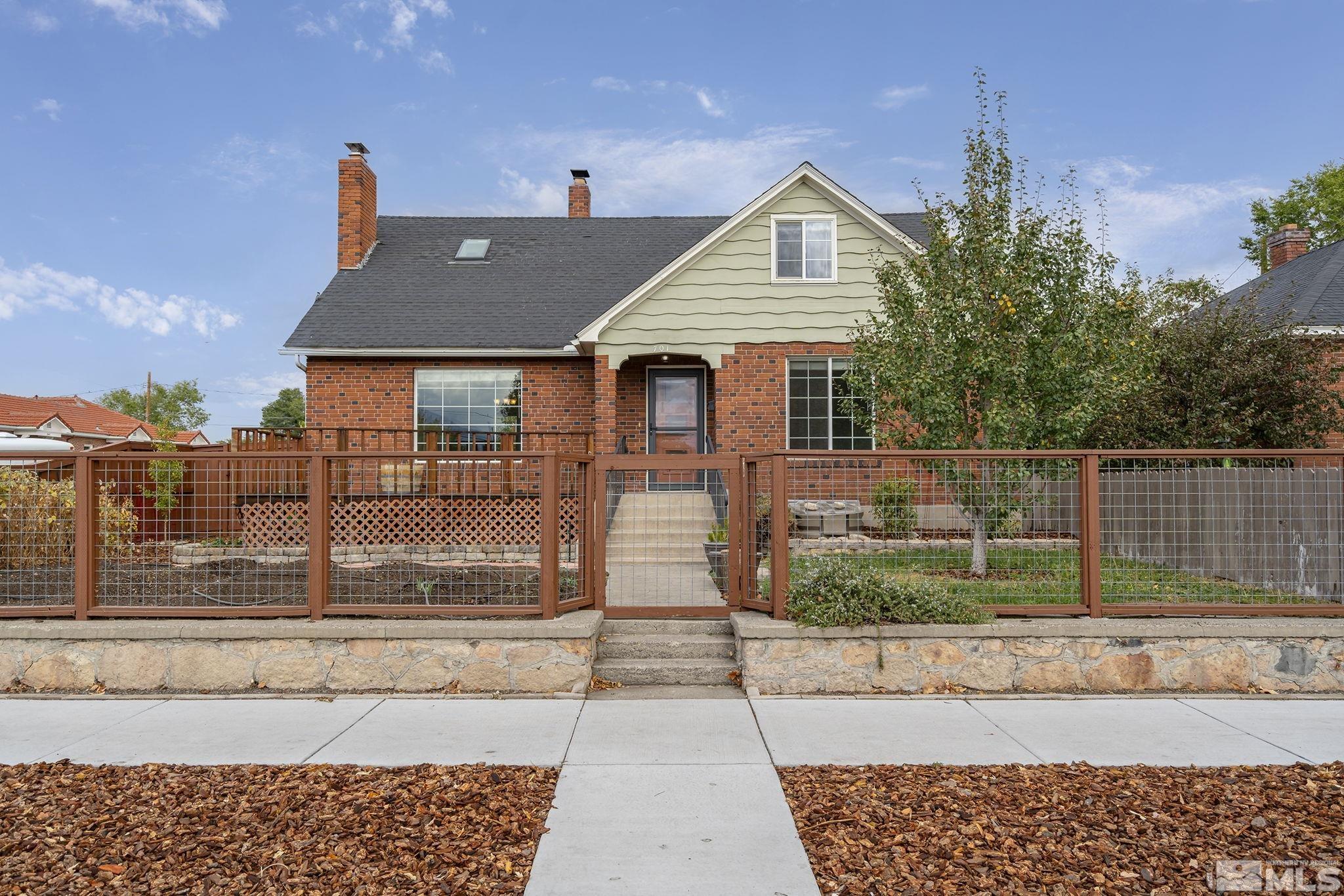 701 Stewart Street Reno, NV 89502 - Photo 1 of 40 a front view of a house with garden