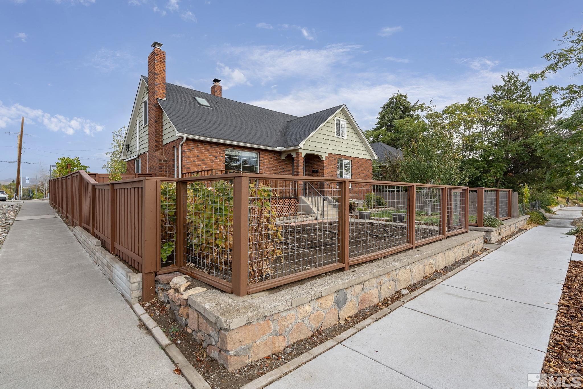 701 Stewart Street Reno, NV 89502 - Photo 2 of 40 a view of a house with wooden fence