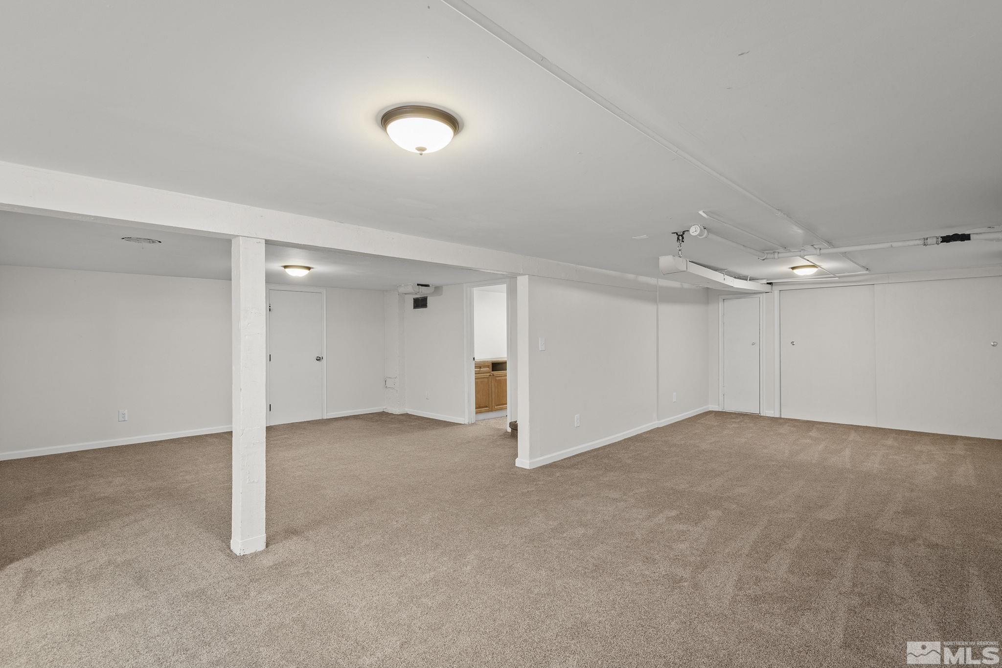 701 Stewart Street Reno, NV 89502 - Photo 26 of 40 an empty room with entrance and windows