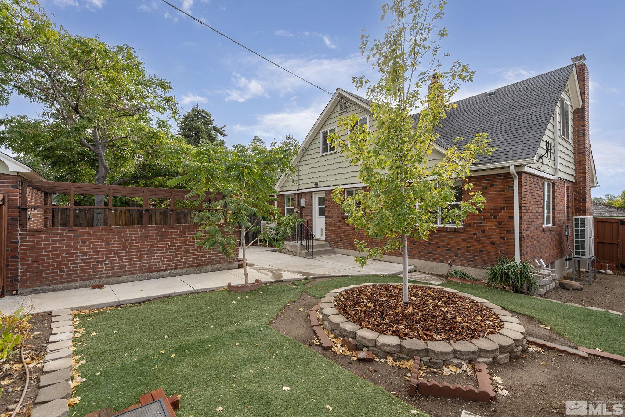 701 Stewart Street Reno, NV 89502 - Photo 29 of 40 front view of a house with a garden