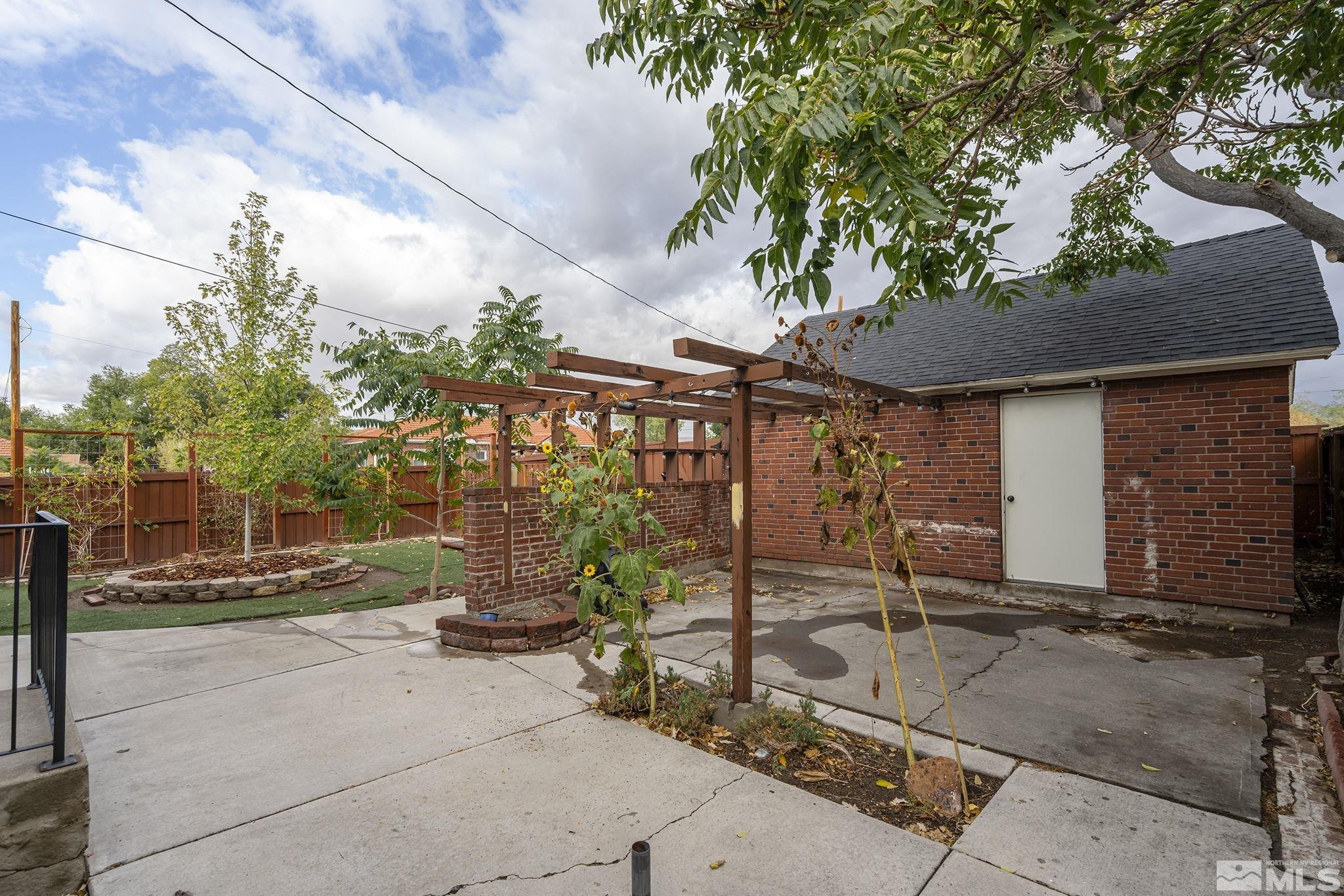 701 Stewart Street Reno, NV 89502 - Photo 30 of 40 a view of a patio with table and chairs and potted plants