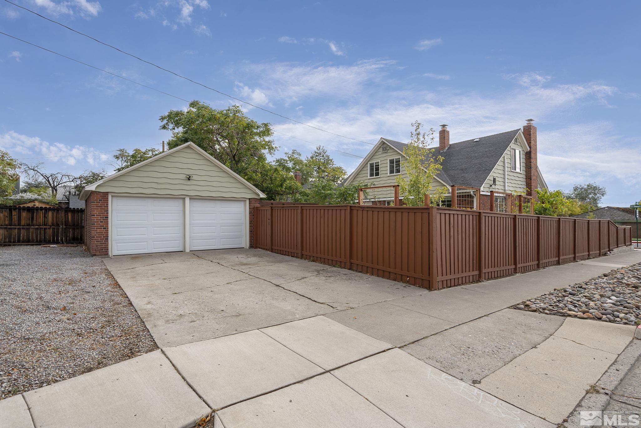 701 Stewart Street Reno, NV 89502 - Photo 3 of 40 a front view of a house with wooden fence