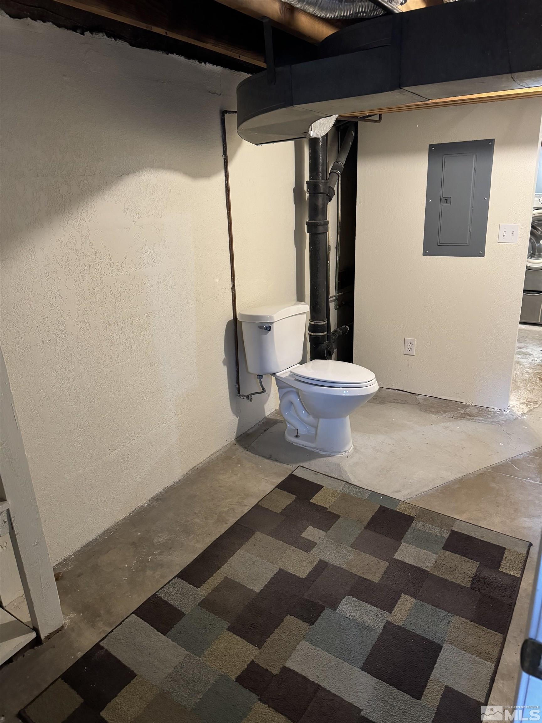 701 Stewart Street Reno, NV 89502 - Photo 38 of 40 a bathroom with a toilet and a shower