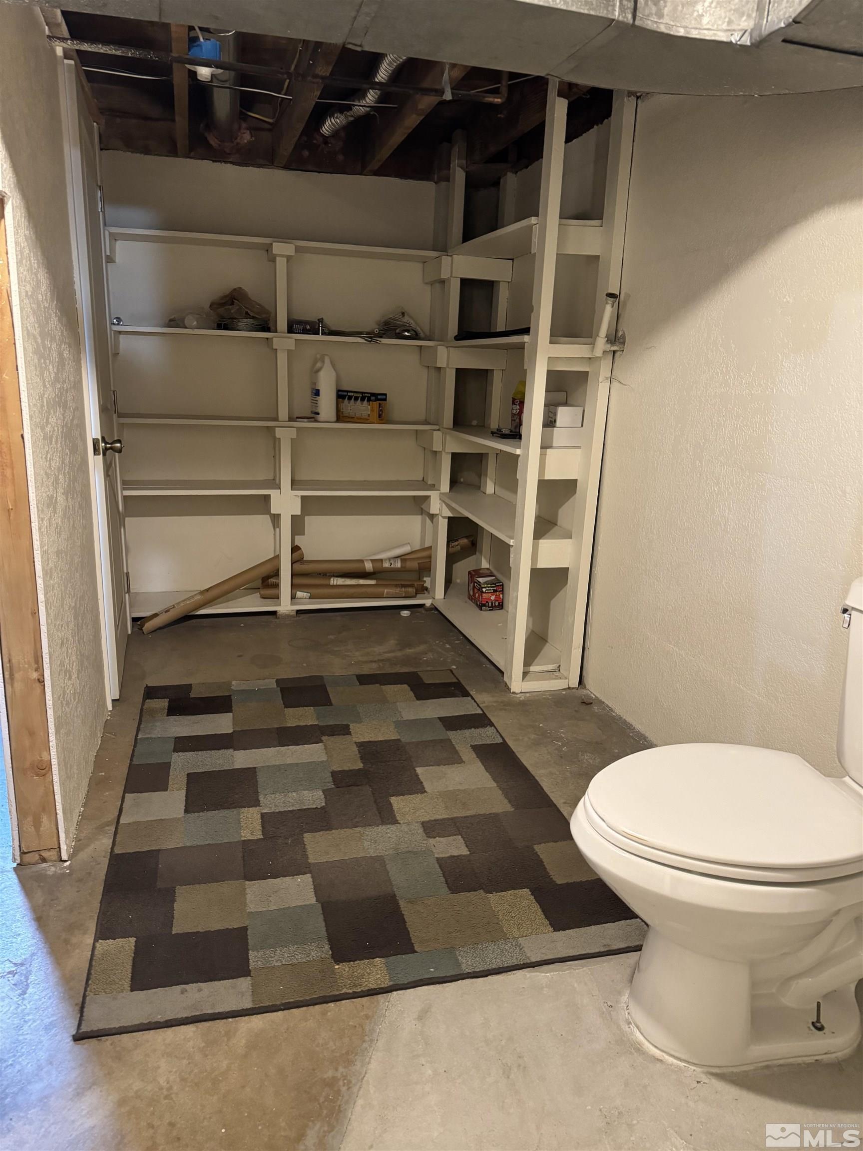701 Stewart Street Reno, NV 89502 - Photo 39 of 40 a bathroom with a toilet and a shower