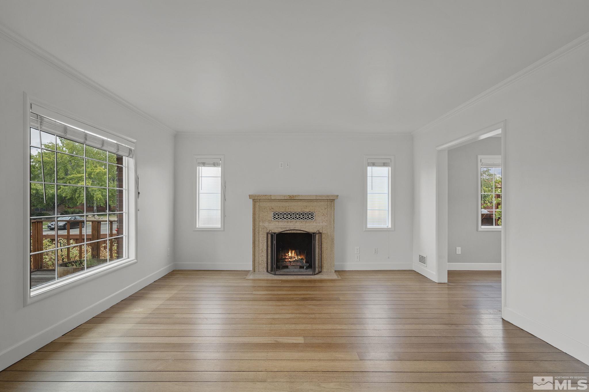 701 Stewart Street Reno, NV 89502 - Photo 5 of 40 a view of an empty room with wooden floor and a window