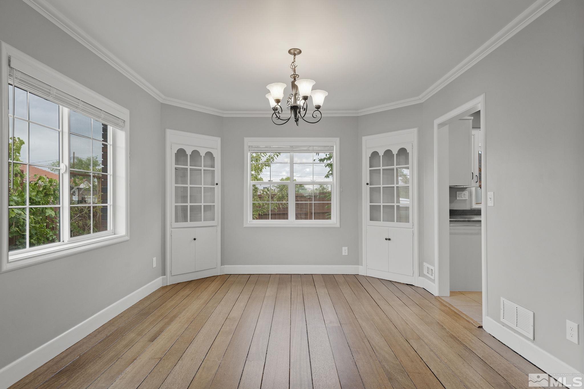 701 Stewart Street Reno, NV 89502 - Photo 8 of 40 wooden floor in an empty room with a window
