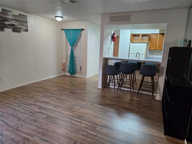 a view of a livingroom with furniture and wooden floor