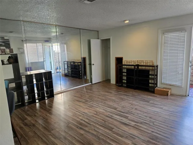 a kitchen with a refrigerator and a sink