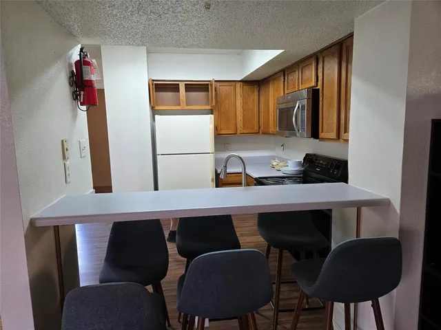 a kitchen with a stove and a sink