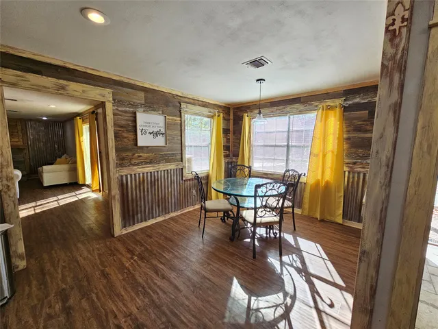 a kitchen with stainless steel appliances granite countertop wooden cabinets stove and sink