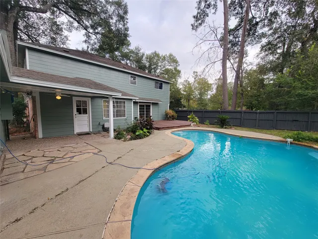 a view of outdoor space with deck and green space