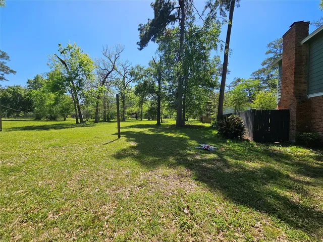 a garden with trees in the background