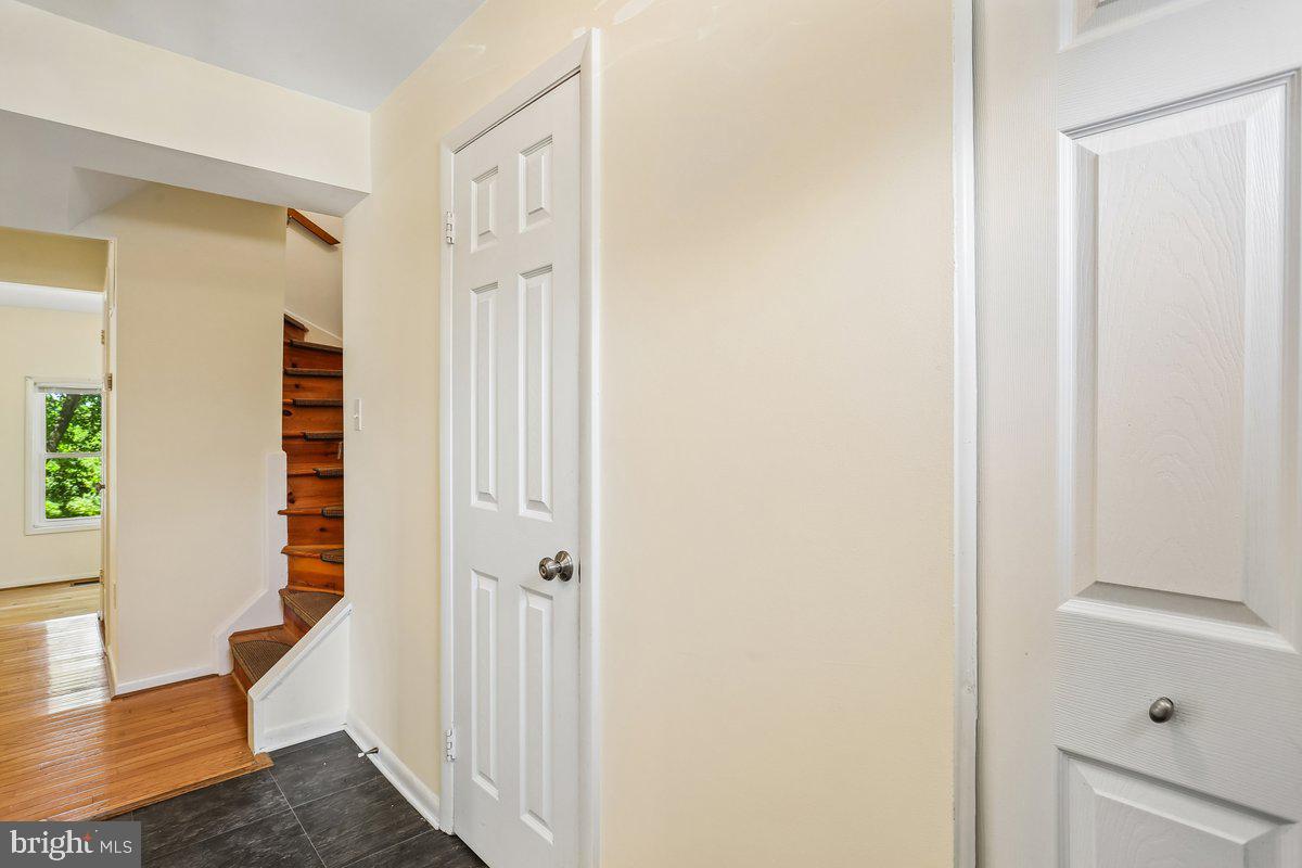 76 Timber Rock Road Gaithersburg, MD 20878 - Photo 9 of 51 a view of a hallway with wooden floor and entryway