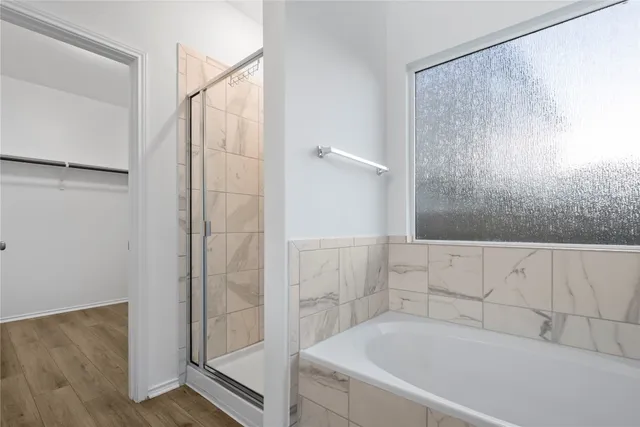 a en suite bathroom with a granite countertop sink