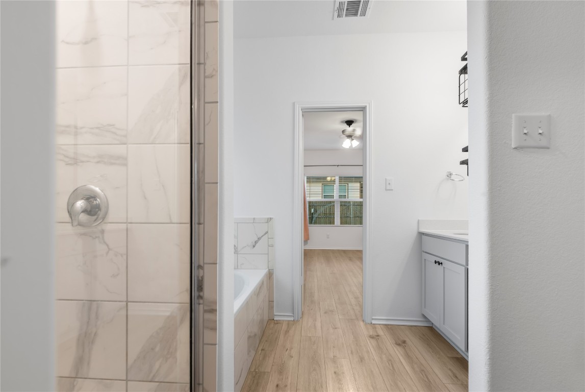 148 Rowdy Yates Way Jarrell, TX 76537 - Photo 13 of 39 a view of a bathroom from a hallway
