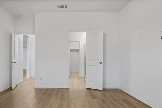 a view of a bathroom from a hallway