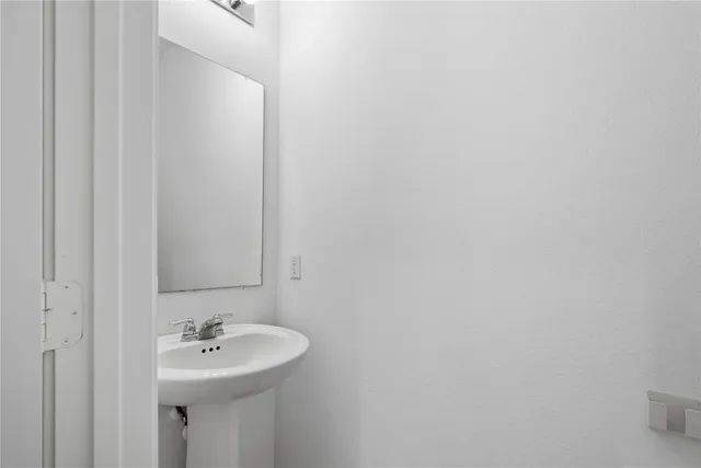 a kitchen with stainless steel appliances granite countertop a sink and a refrigerator