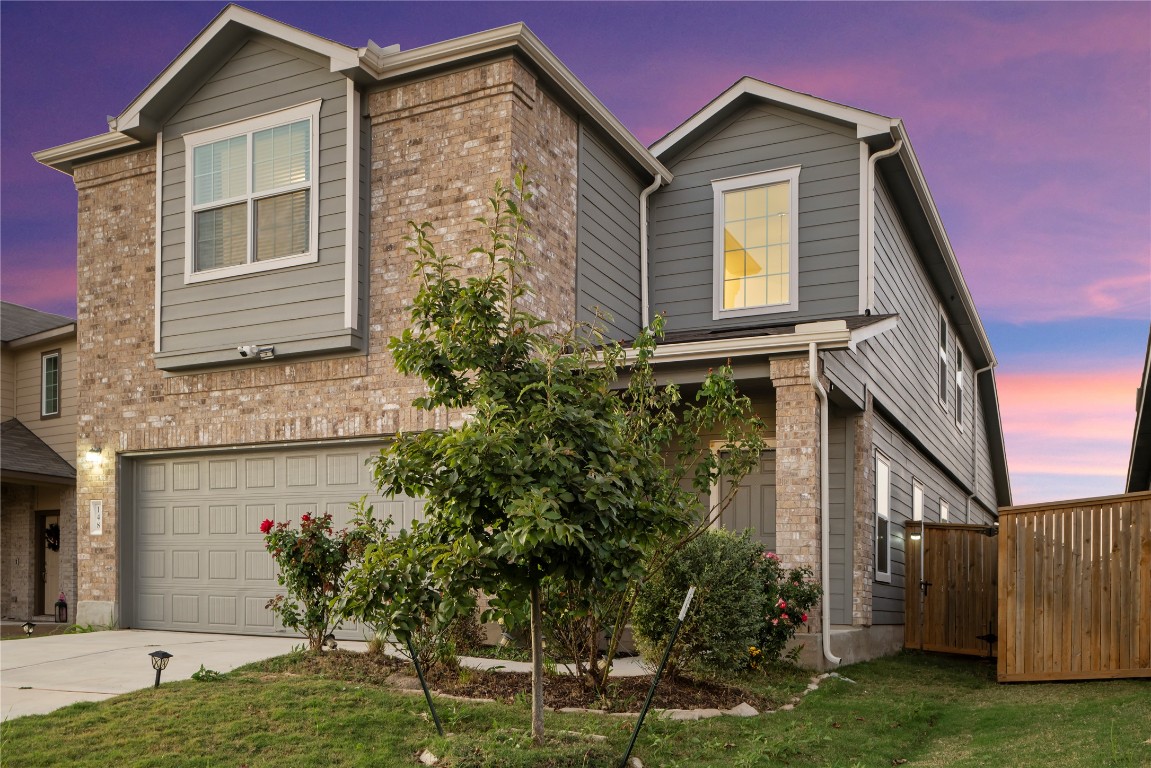 148 Rowdy Yates Way Jarrell, TX 76537 - Photo 2 of 39 a front view of a house with a yard