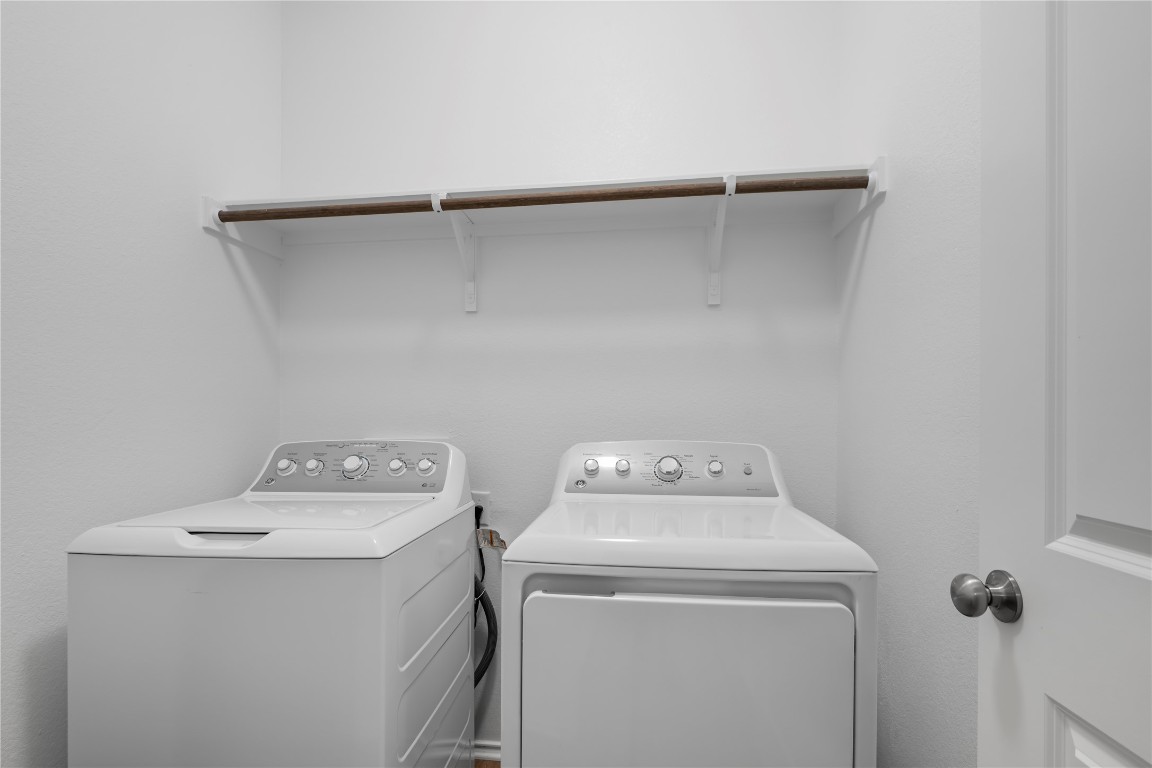 148 Rowdy Yates Way Jarrell, TX 76537 - Photo 20 of 39 a utility room with dryer and washer