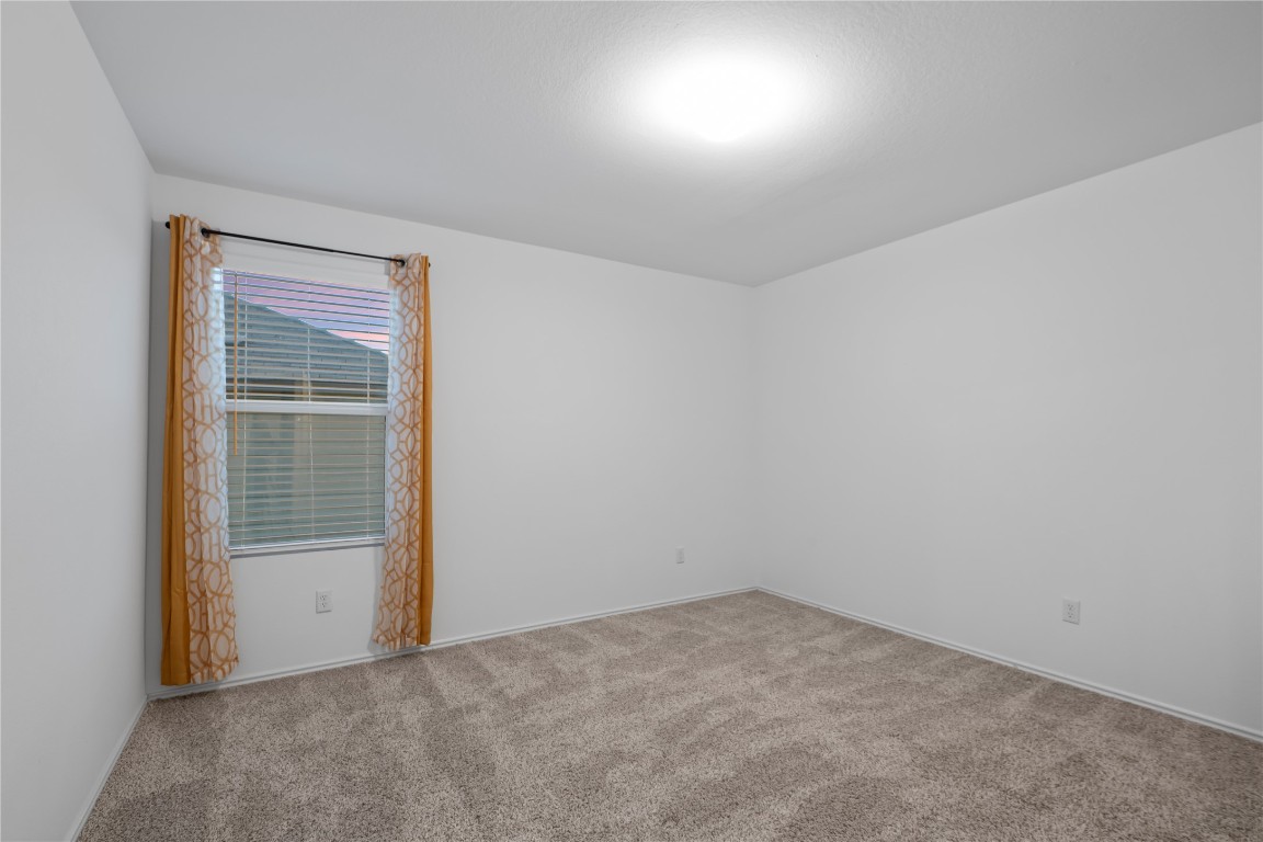 148 Rowdy Yates Way Jarrell, TX 76537 - Photo 29 of 39 an empty room with windows