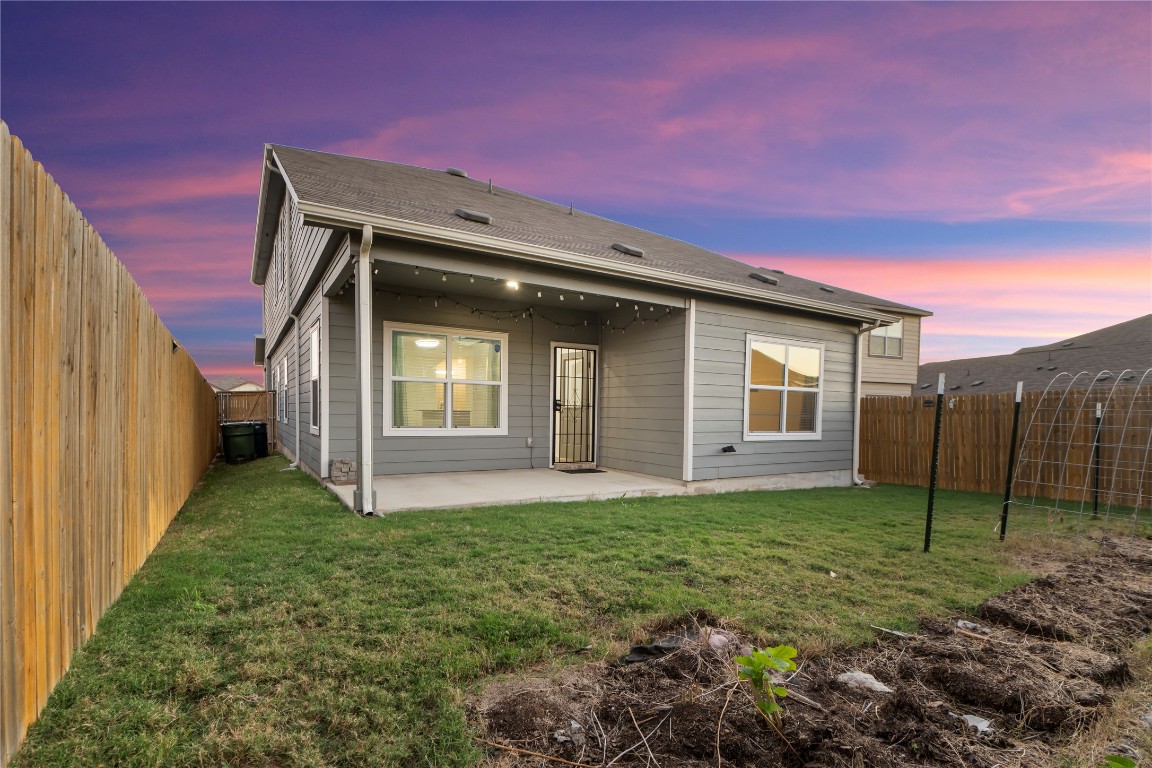 148 Rowdy Yates Way Jarrell, TX 76537 - Photo 34 of 39 a backyard of a house with lots of green space