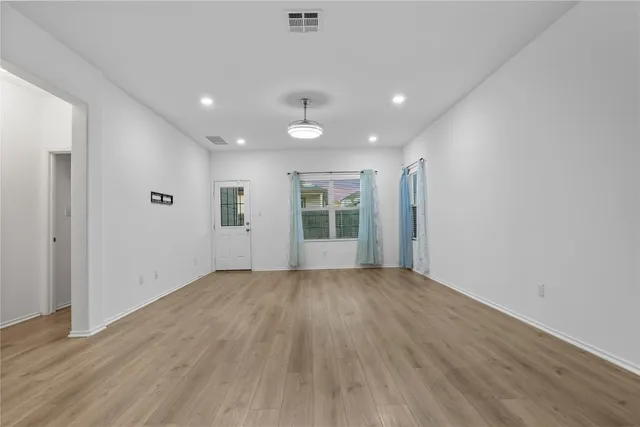 a view of kitchen with stainless steel appliances refrigerator oven microwave and stove