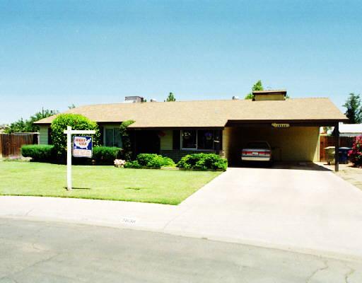 5838 West Granada Road Phoenix, AZ 85035 - Photo 1 of 1 a front view of house with a garden and patio